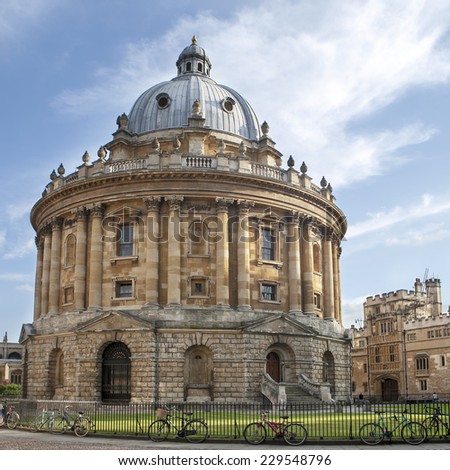 Oxford, UK - August 27, 2014: view of the Radcliffe Camera with All Souls College in Oxford, UK. The historic building is part of Oxford University Library.