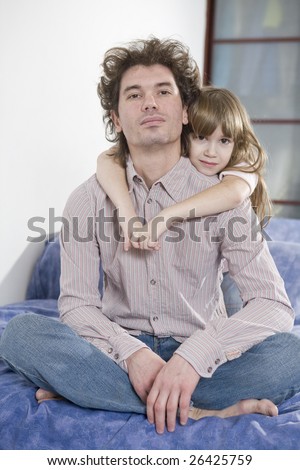 happy family. Father and daughter.  Daughter hugs father