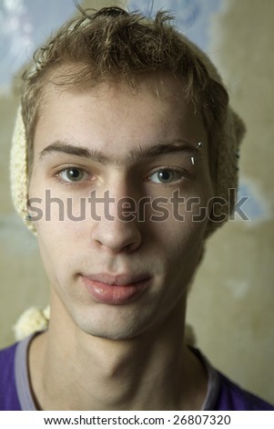 closeup portrait of young cute man wearing hat