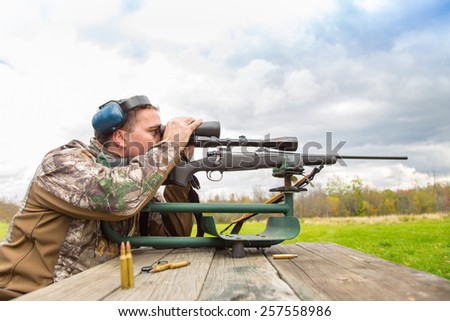 Shooter sights in rifle
