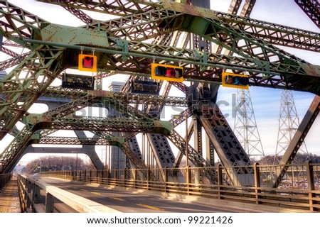 Quebec city\'s cantilever bridge with moving car.