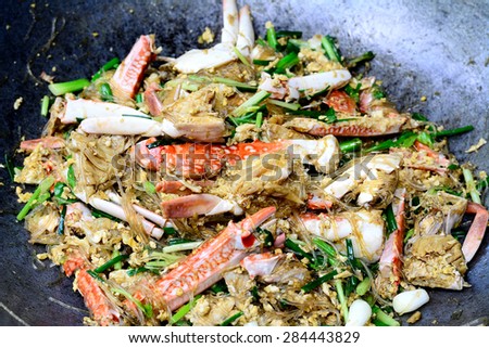 Thai Food (Boo Pad Pong Karee) : Sea Crab  stir fried  in Yellow Curry with Coconut Milk and cellophane noodle in pan