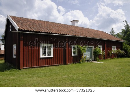 Red summer house. The red color with white framing common in Sweden.