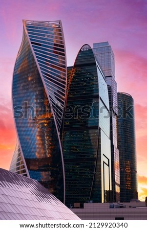 Similar – Image, Stock Photo Gloomy skyscraper facade with graphically cut hedge plant