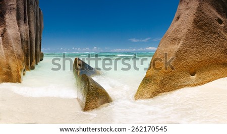 Landscape Seychelles lagoon with clean sand with stones and with a clear turquoise sea