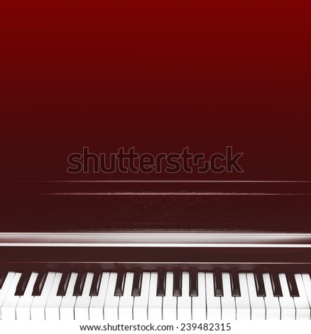 abstract grunge music background with piano keys on red
