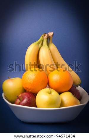 Still life with banana, oranges and apples