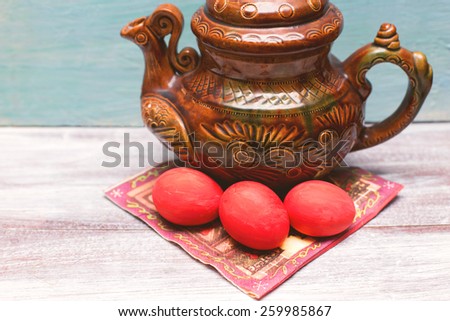 Easter red eggs and soup tureen