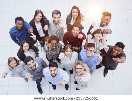 Similar – Image, Stock Photo Hands of a multi-ethnic group of friends joined together as a sign of support and teamwork.