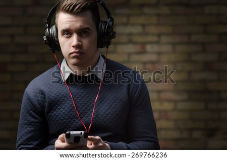 Attractive young male model with headphones