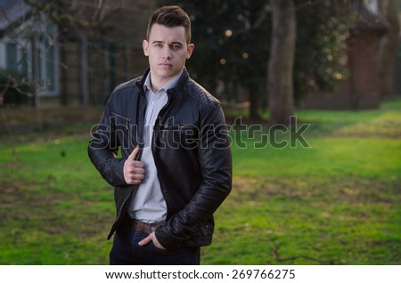 Attractive young male model posing outdoors
