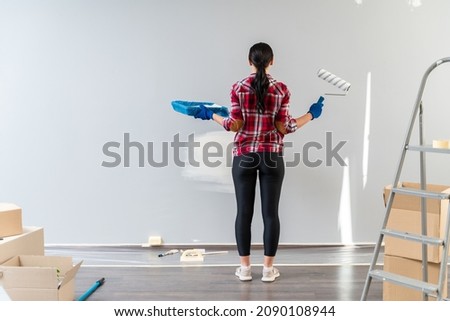 Similar – Image, Stock Photo Cheerful woman preparing paint during renovation