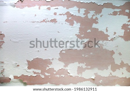 Old peeling paint on a wall or ceiling for stripping and repainting remodel renovation Photo stock © 