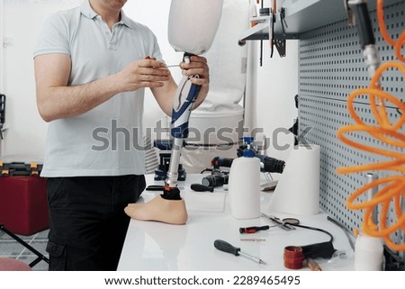 Similar – Image, Stock Photo Crop worker assembling mechanism in workshop