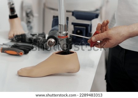 Similar – Image, Stock Photo Crop worker assembling mechanism in workshop