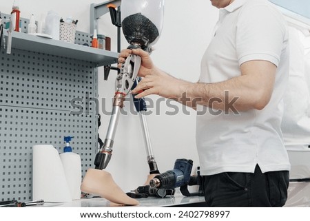 Similar – Image, Stock Photo Crop worker assembling mechanism in workshop