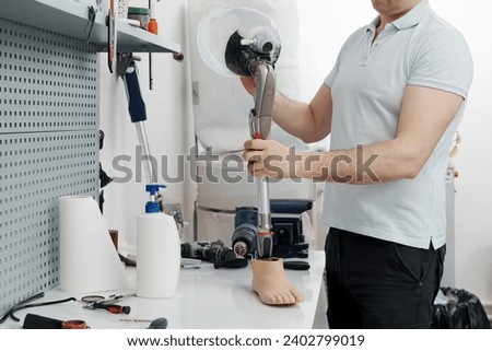 Image, Stock Photo Crop worker assembling mechanism in workshop