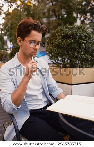 Similar – Image, Stock Photo Relaxed man reading notes in notebook