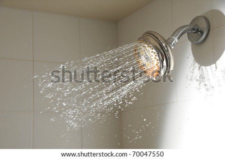 Water spray just starts coming out of a shower head