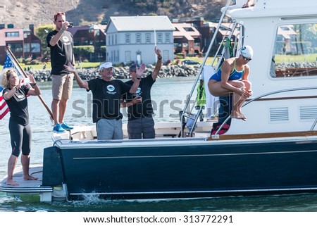 SAN FRANCISCO - SEPTEMBER 06, 2015: Grace van der Byl begins her first swim in a world record attempt for the longest relay open water swim in San Francisco Bay on September 06, 2015.