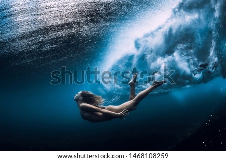 Similar – Image, Stock Photo Young woman in diving mask swimming underwater