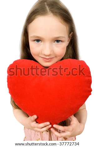nice little girl with soft heart toy isolated on white with clipping path