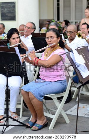 Woman play the flute in orchestra in Havana, Cuba on May 10, 2013.
