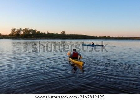 Similar – Image, Stock Photo Two kayaks on the water with reflection