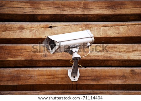 Camera on a wall of wooden houses