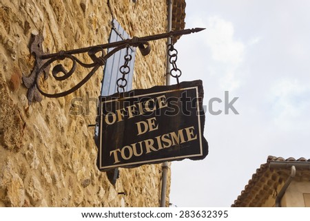 Office de Tourisme hanged sign in France, Europe.