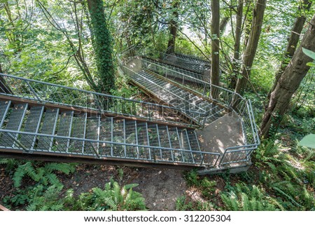 Metal stairs crisscross leading down to the Puget Sound at Eagle Landing Park in Burien, Washington.