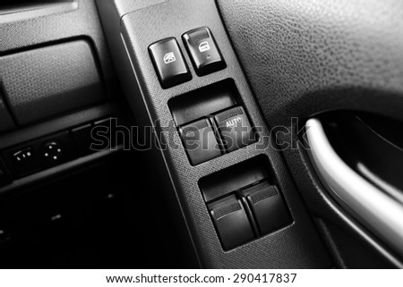 Car door interior armrest with window control panel, door lock button, and mirror auto  and manual control with monochrome
