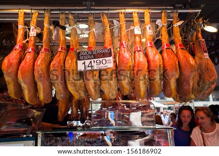 BARCELONA, SPAIN - AUG 05: Ham stands at La Boqueria market on August 05 2013 in Barcelona, Spain. Most famous market in Barcelona daily visited by thousands of tourists