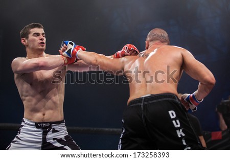 ZAGREB, CROATIA - NOVEMBER 2, 2013: Final fights at Croatian MMA legaue. Zdravko DUKIC (blue gloves) VS Lovro VRKIC (red gloves).