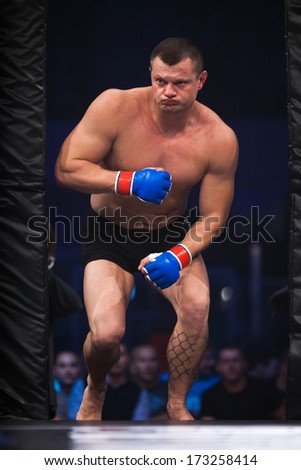 ZAGREB, CROATIA - NOVEMBER 2, 2013: Final fights at Croatian MMA legaue. Drazen GLAVAS (blue gloves) entering the cage.