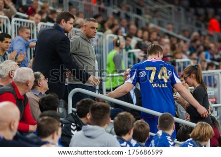 ZAGREB, CROATIA - FEBRUARY 9, 2014: VELUX EHF Men\'s Champions League 2013/2014 - CO Zagreb (CRO) VS Motor Zaporozhye (UKR). Mario VUGLAC (74) on stands after receiving red card.
