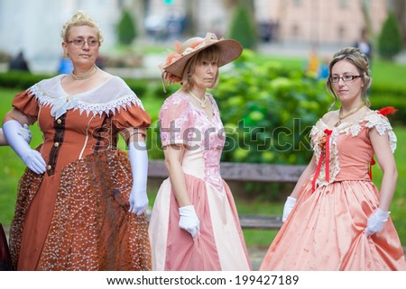 ZAGREB, CROATIA - MAY 31, 2014: Women wearing historic clothes during promenade concerts at park Zrinjevac, one of oldest park in city.