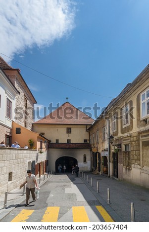 ZAGREB, CROATIA - MAY 2, 2009: Tourists in front of the Stone Gate - the eastern gate to medieval Gradec Town,  now a shrine.