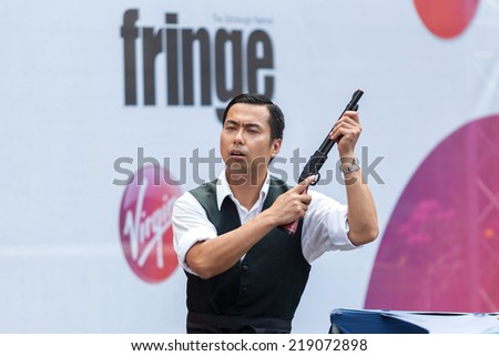 EDINBURGH, SCOTLAND: AUGUST 8, 2014: Artist performing on Fringe festival. Fringe is the very popular and largest arts festival in the world.
