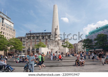 AMSTERDAM - NETHERLANDS: AUGUST 1, 2014: People around the National Monument at Dam Square.