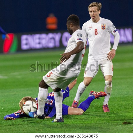 ZAGREB, CROATIA - MARCH 28, 2015: EURO 2016 qualifiers, group H - Croatia VS Norway. Ivan RAKITIC (7) lying on the pitch with ball in his face.