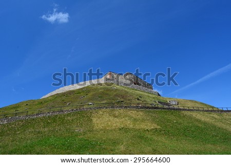 Old stone fortress in the open air in the city of Vilnius\
on the background of blue sky