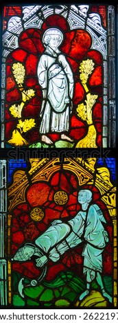 GLASGOW, SCOTLAND - MARCH  19, 2015: Stained glass panel made  in France dated 1320-1340, depicting Saint Nicaise and Saint Clement, exhibited in The Burrell Collection