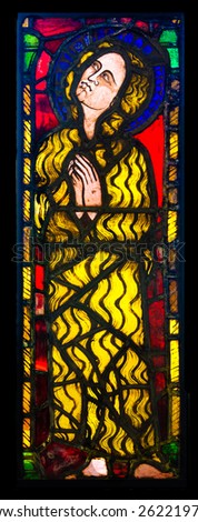 GLASGOW, SCOTLAND - MARCH  19, 2015: Stained glass panel made  in France circa 1320, depicting Saint Mary Of Egypt, exhibited in The Burrell Collection