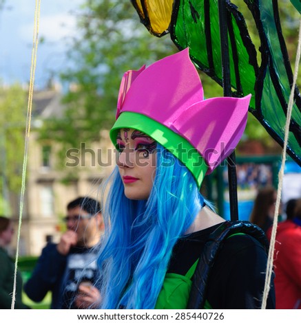 GLASGOW, SCOTLAND -  7 JUNE, 2015: Participants in the streets of Glasgow during the West End Festival Sunday Parade, route is from Botanic Gardens to Kelvingrove Park