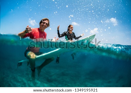 Similar – Image, Stock Photo Surfing couple waiting for the wave