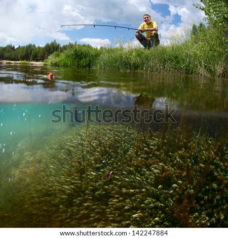 Young man fishing on a green pond\'s coast with underwater view of weed on a bottom