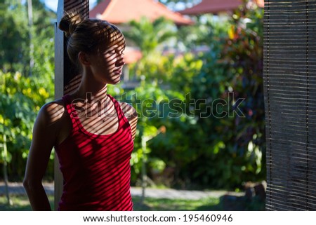 Young lady relaxing in the garden