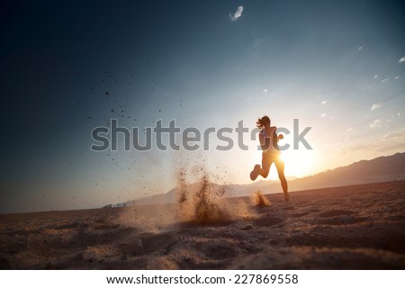 Similar – Image, Stock Photo Sportsman jogging on sandy terrain in mountainous terrain