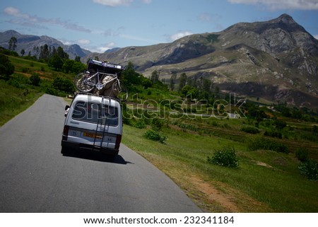 MADAGASCAR- DECEMBER 23, 2013. Overloaded bus moves in the mountains.